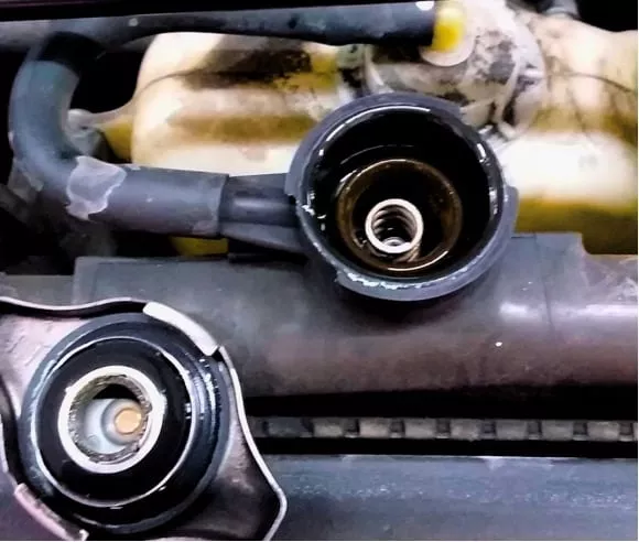 Why is my radiator level low but coolant reservoir full? Brock