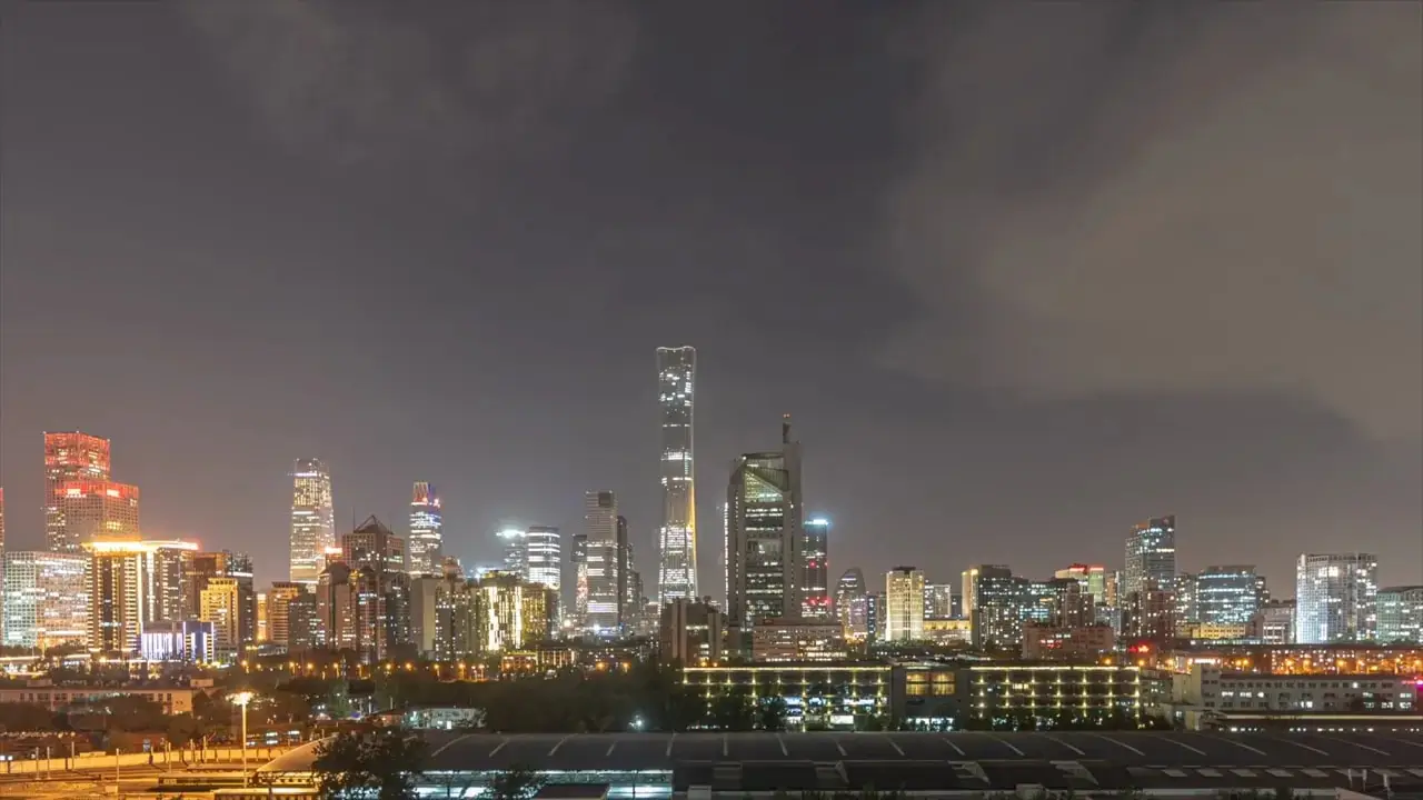 On-screen segment discussing Beijing land sales and property market weakness