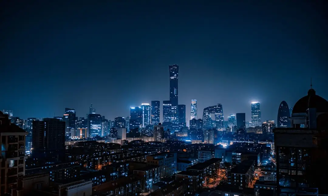 China city skyline night lights business news editorial