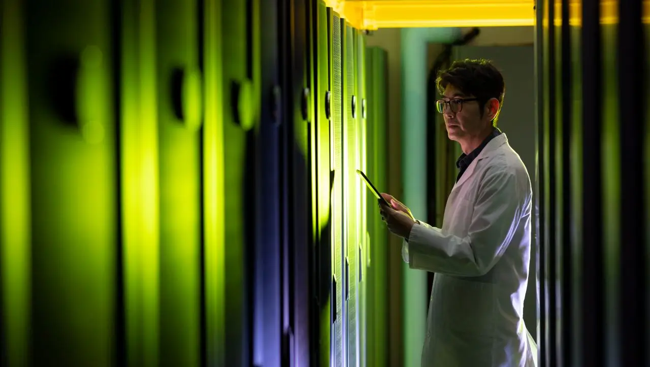China technician-using-tablet-in-server-room-environment Datacenter build out s china technician using tablet in server room environment datacenter build out s
