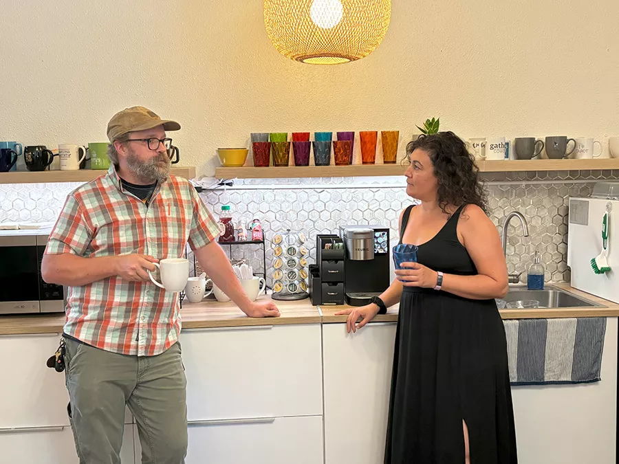 HybridCoworking Woman using computer desk at Cowork and Connect as part of their amenities