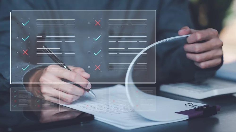image_Businessman,Checking,The,Steps,Through,Document,With,A,List,Of