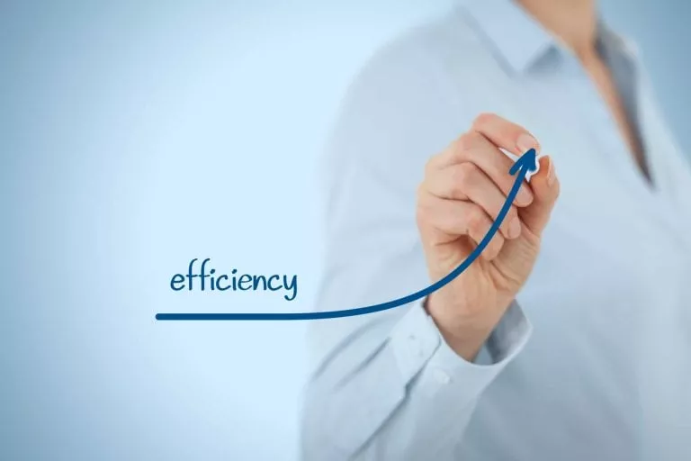 Person in white shirt drawing a graph in blue ink using the word efficiency - Evergreen Maintenance commercial cleaning and janitorial services.
