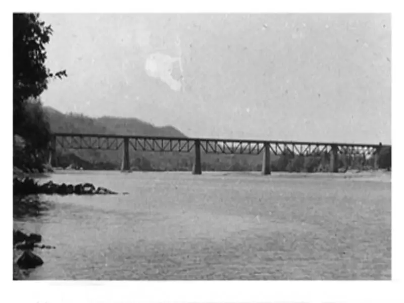 A multi-span bridge over a large river with piers founded in river bed