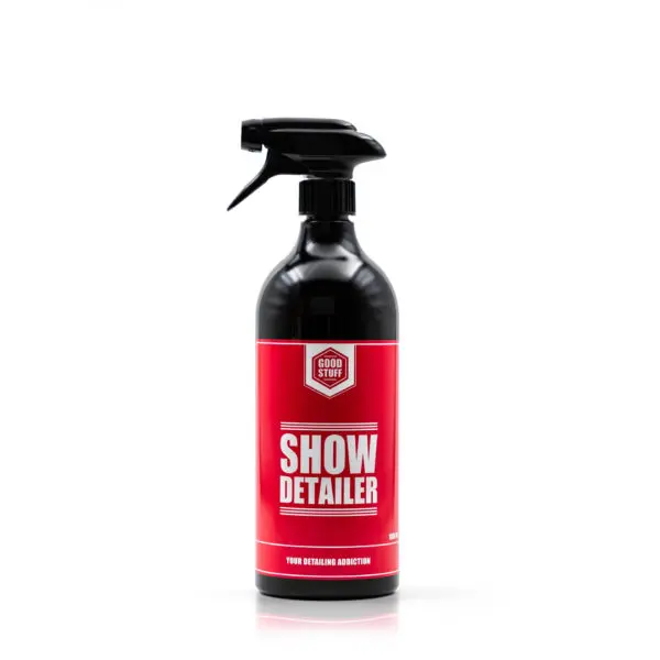 A black spray bottle with a red label that reads Show Detailer in large white letters, designed for exterior car care and perfect for giving your vehicle a just-waxed finish. The background is plain white.
