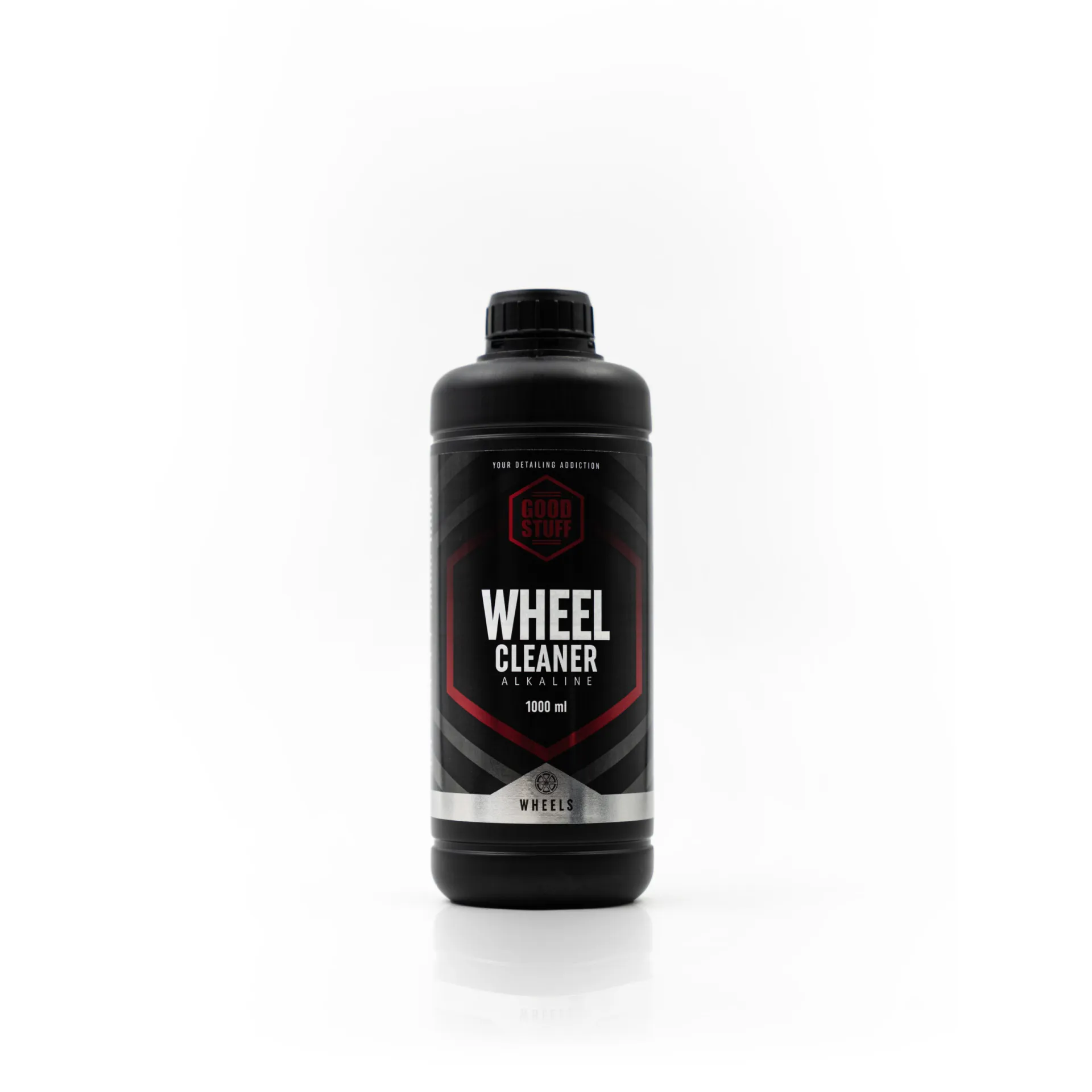 A black plastic bottle of Good Stuff Wheel Cleaner with a black screw cap, featuring a red and white label that reads “Wheel Cleaner Alkaline 1000 ml,” photographed on a white background—an essential for effective wheel care.
