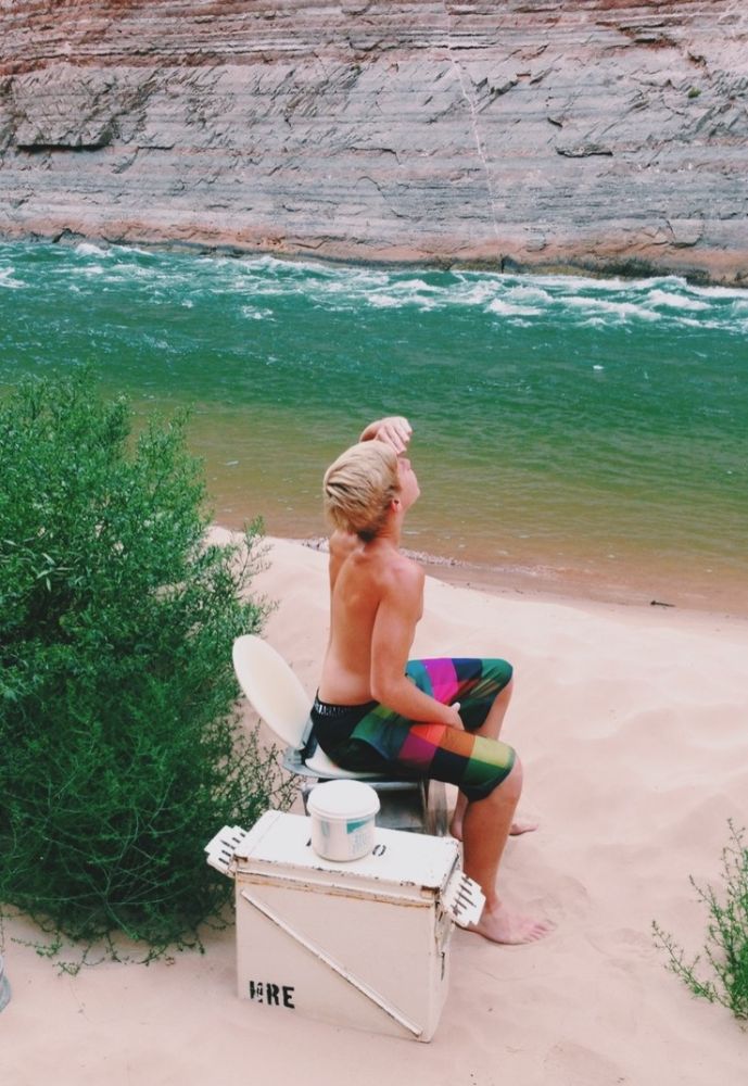 HRE_Let’s Talk about Bathrooms boy sitting on a porto during a river trip