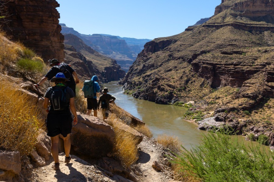 Side Hikes on a Grand Canyon River Trip: What You Need to Know 1 Group hiking a little above the Colorado River