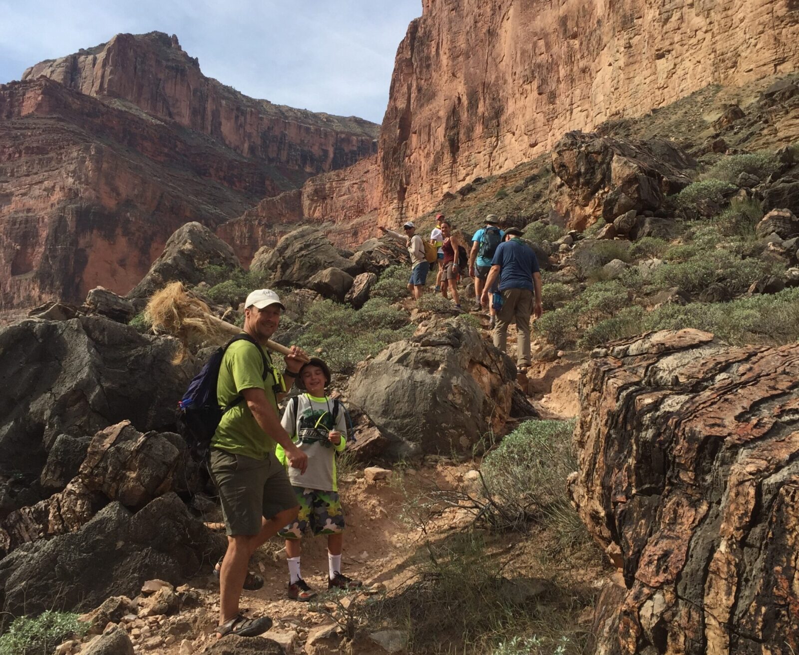 Hiking in Grand Canyon with Hatch River Expeditions Guests hiking up a rocky trail in the Grand Canyon. Photo credit: Wally Werderich.