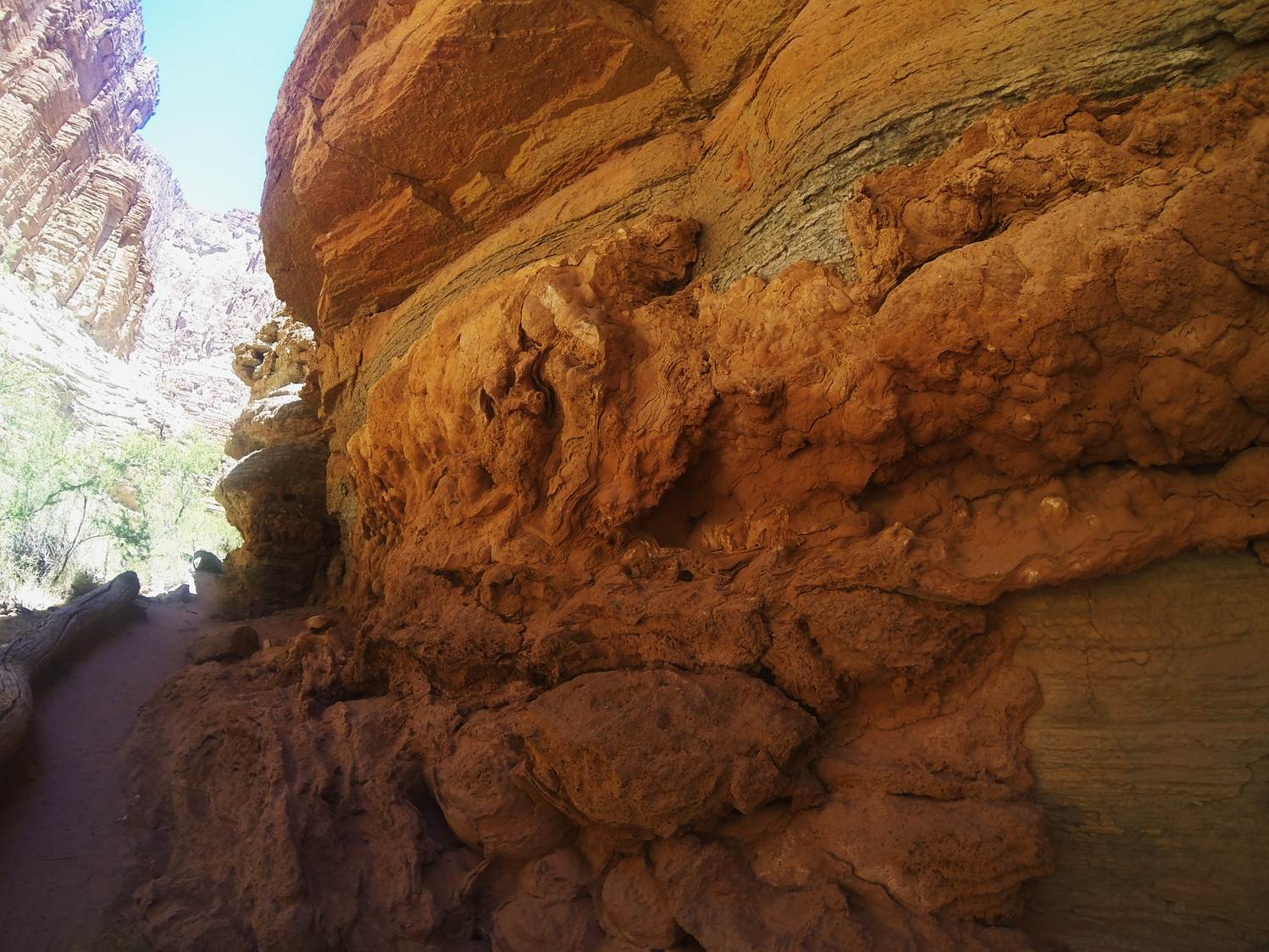 What’s With the Super Blue Water in Grand Canyon? 1 A calcium carbonate deposit of travertine along a trail in Grand Canyon.