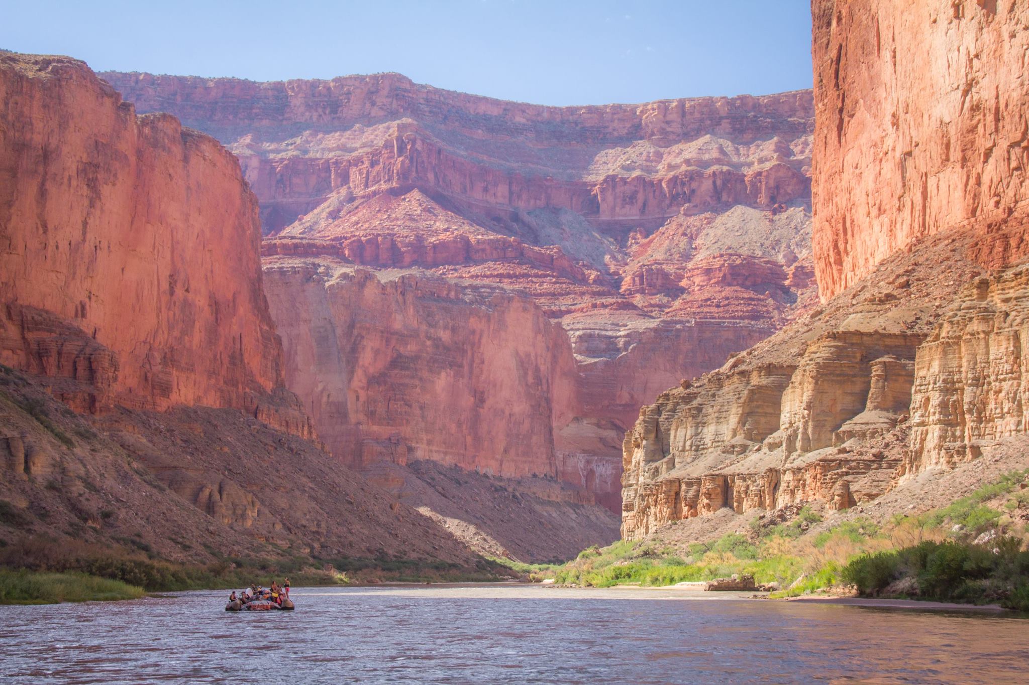 Hatch rafting Grand Canyon. Photo credit: R. Ben Lehman. Photo of Hatch raft dwarfed by the walls of the canyon, showing why 1 or 2 day rafting trips in Grand Canyon are difficult. Thanksgiving at Hatch. Photo credit: R. Ben Lehman.
