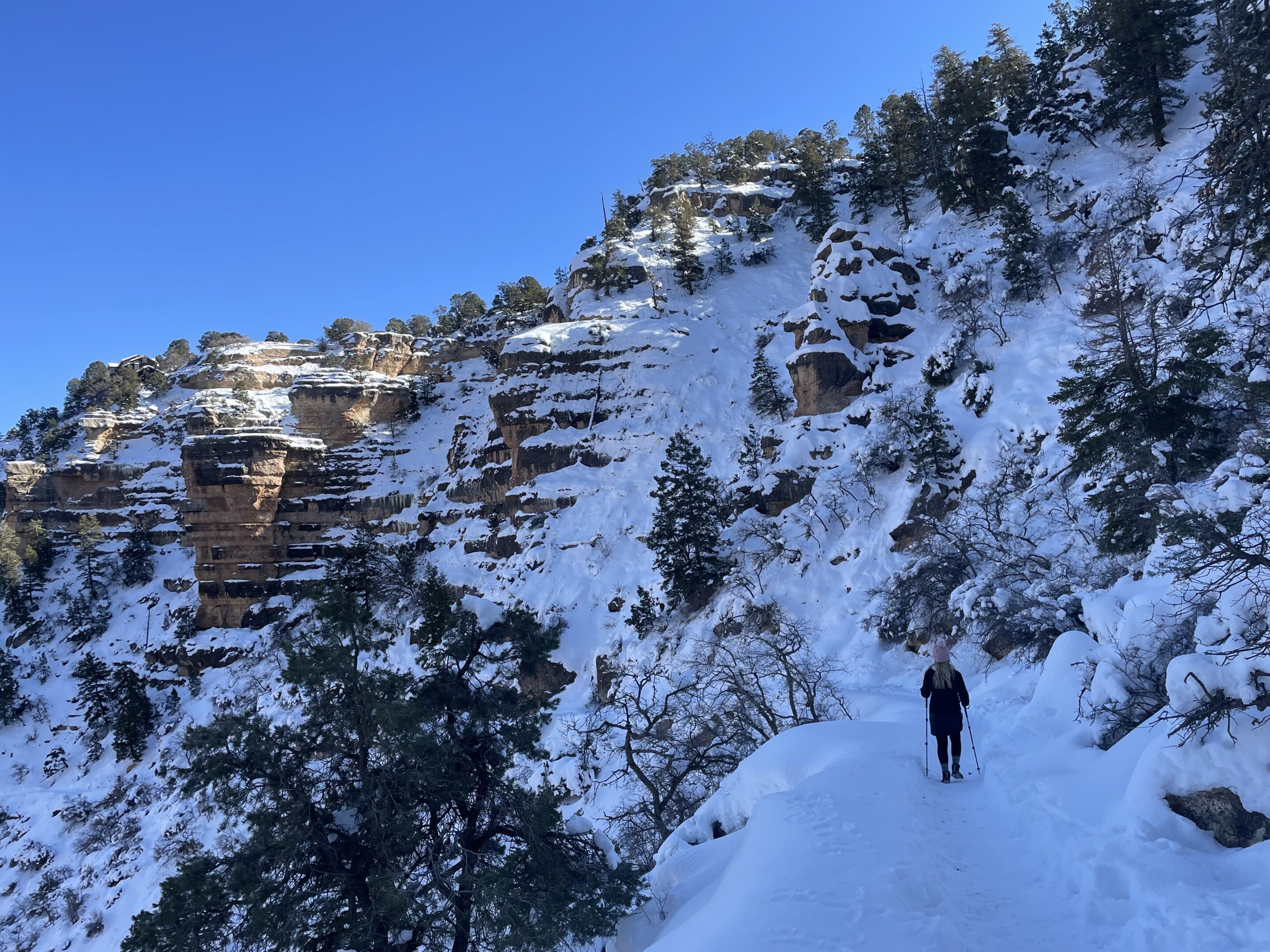 IMG_1345 Woman hiking snow covered Bright Angel Trail in Grand Canyon in winter