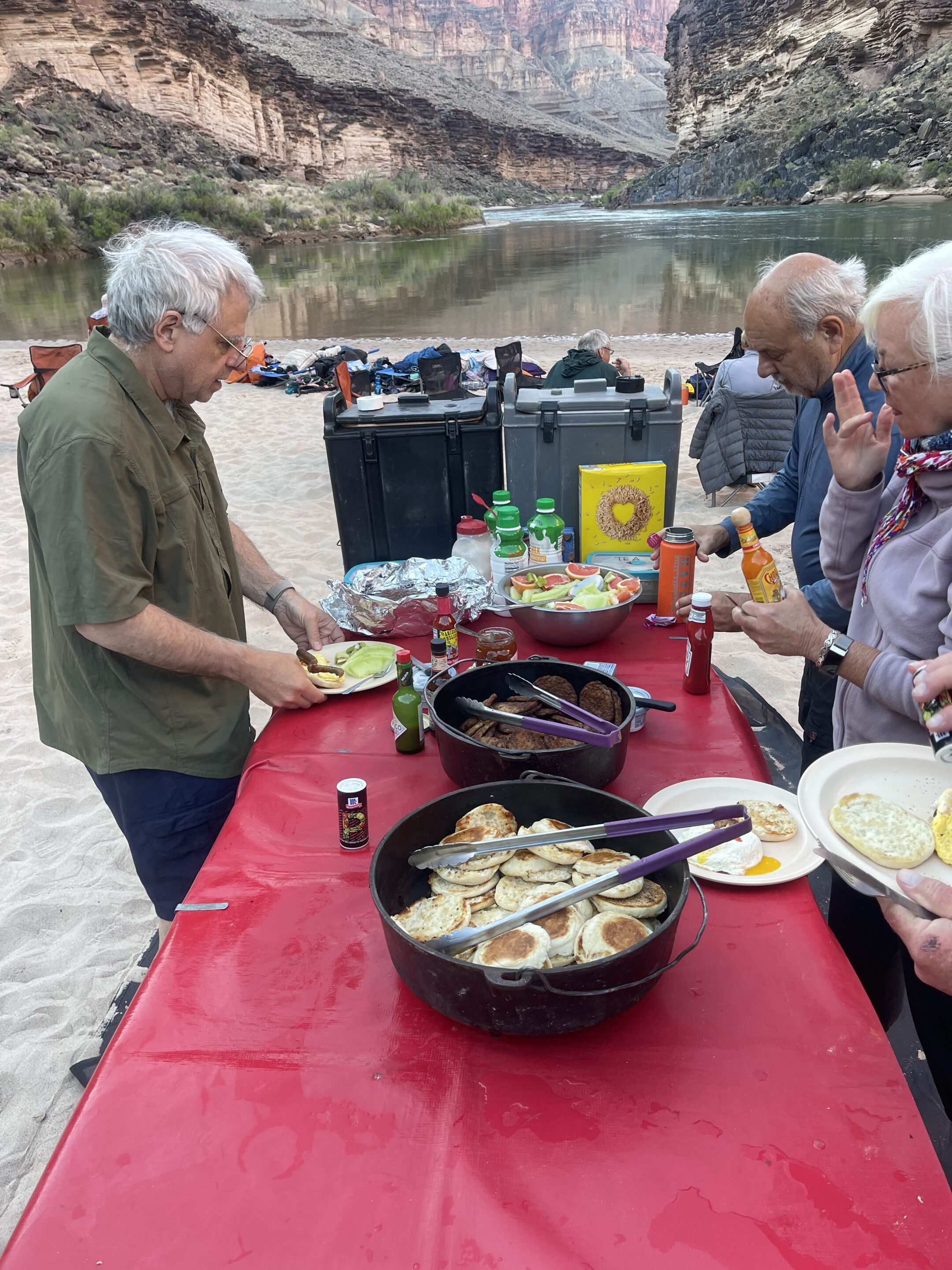 Eating on the River – Hatch Meals and How They Work 1 Breakfast table on a Hatch river trip with English muffins, sausage patties, fresh fruit, cereal, and other items. Photo credit: John Dillon.