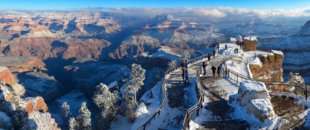 5 Reasons to Visit Grand Canyon This Winter 1 Mather Point vista at the Grand Canyon South Rim on a cold winter day with some snow on the ground
