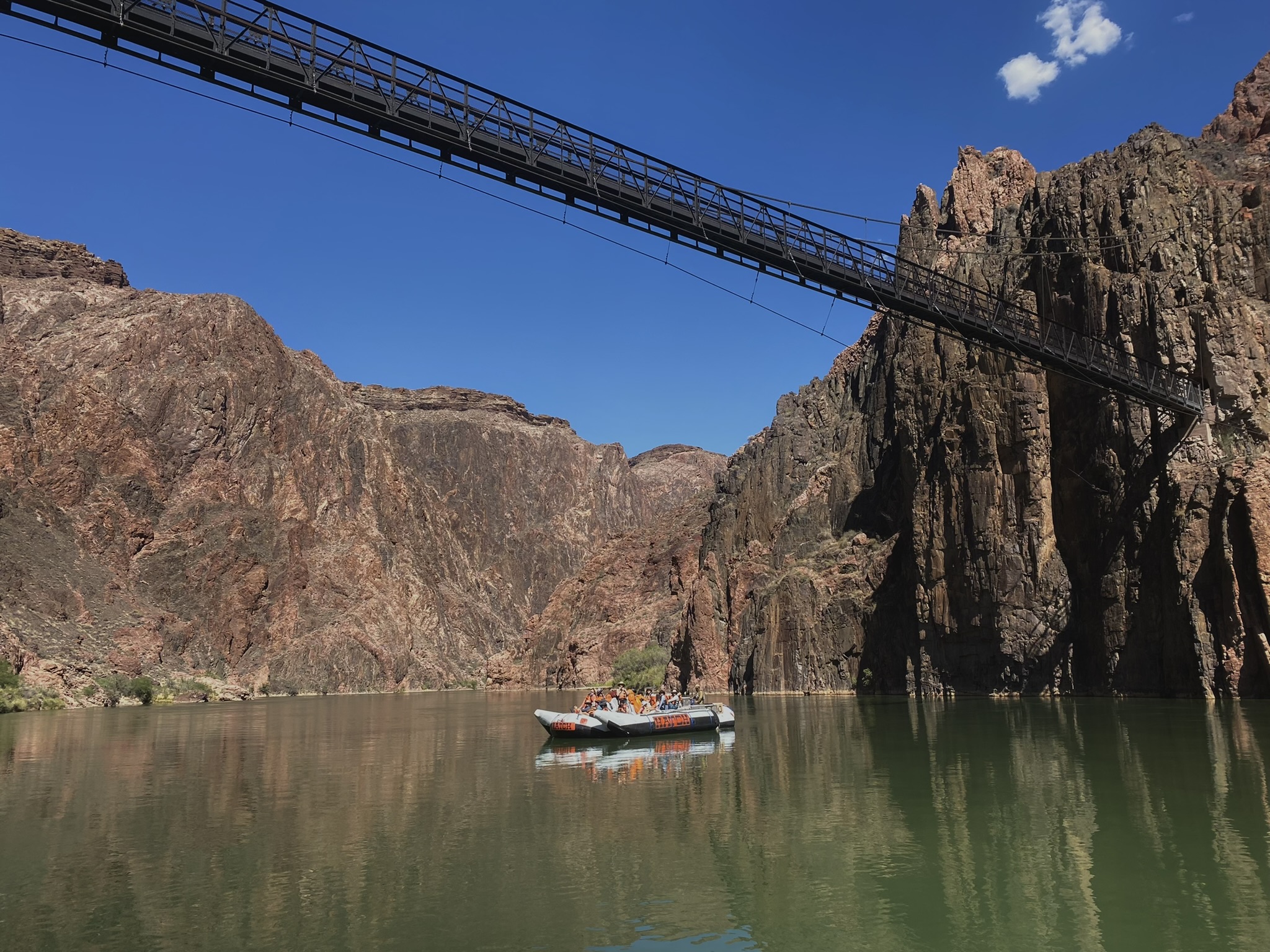 Hatch Boat under KSB Cr:Jenna Lees Hatch motor boat passing under the Kaibab Suspension Bridge