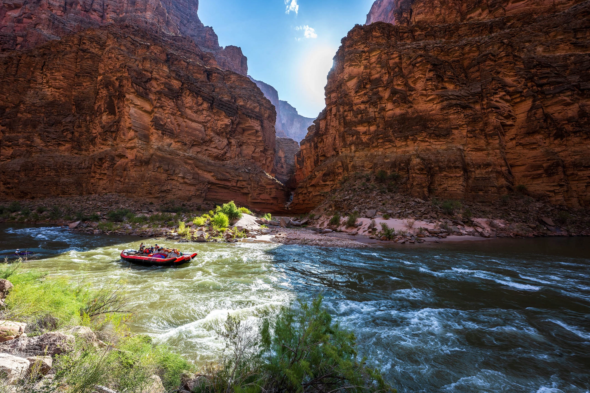 Hatch boat on water Credit: Micheal Nuemann Plan a grand canyon rafting trip on a hatch motor boat Credit: Micheal Nuemann