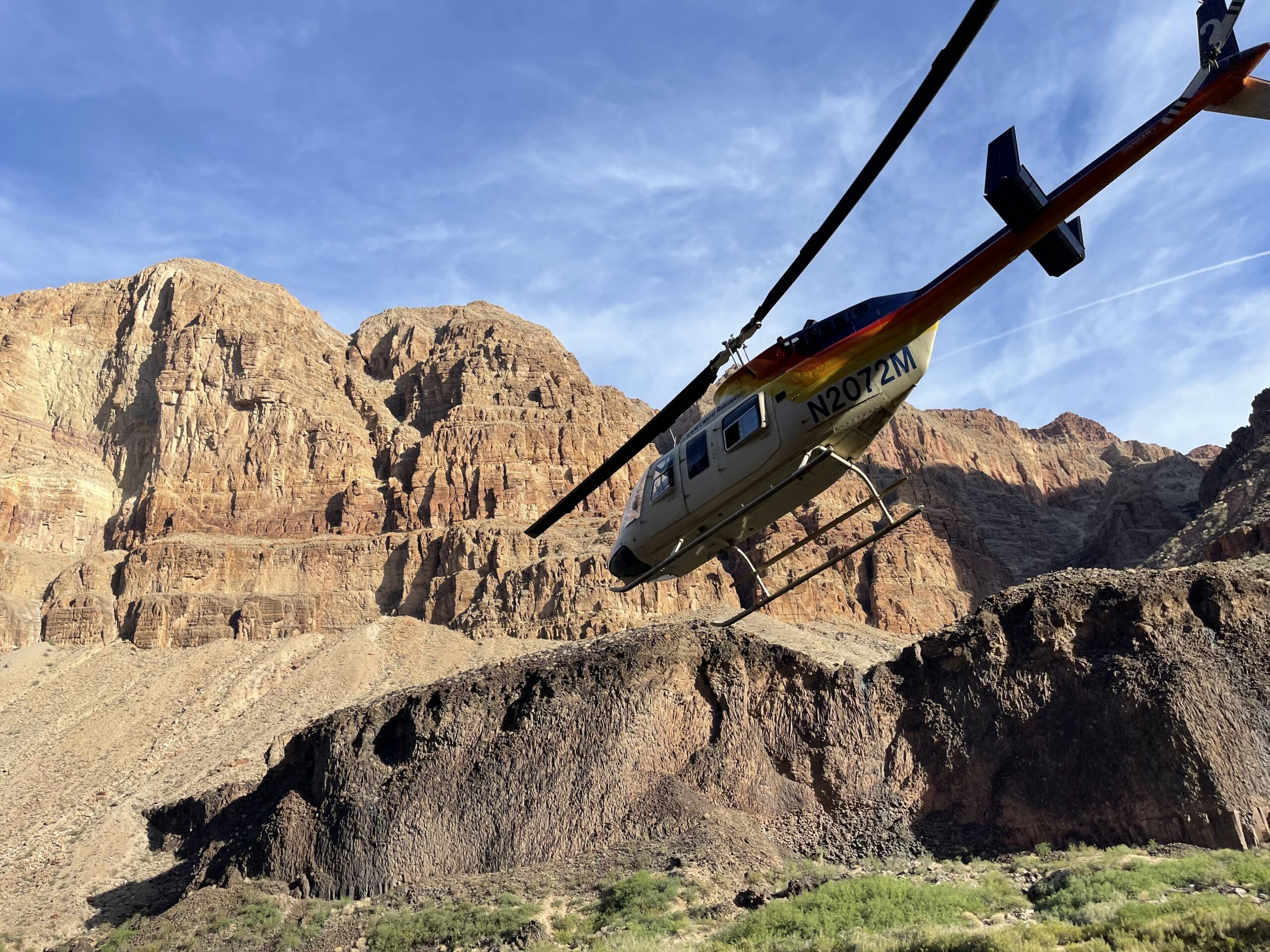 Why Is Hatch’s 7 Day Full Canyon Motorized Rafting Trip So Popular? 2 A helicopter flies out of the Grand Canyon carrying Hatch passengers. Hatch trips camp at Whitmore Wash and are the first to board the helicopters and exit the canyon. Photo credit: John Dillon.