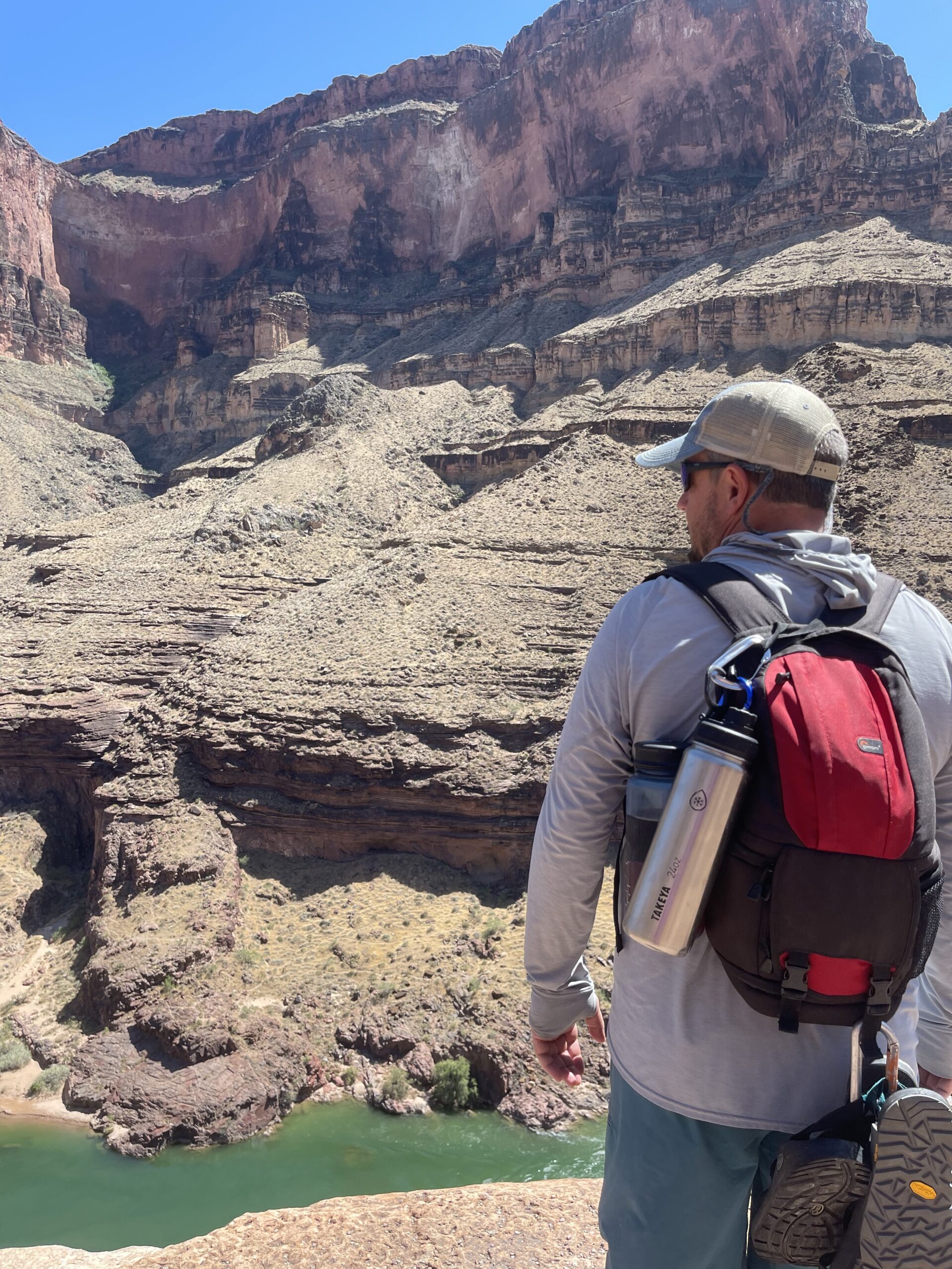 Drinking Water on Hatch River Trips: Your FAQs 2 A Hatch guest on a Grand Canyon hike has a water bottle clipped to his backpack. Photo credit: John Dillon.