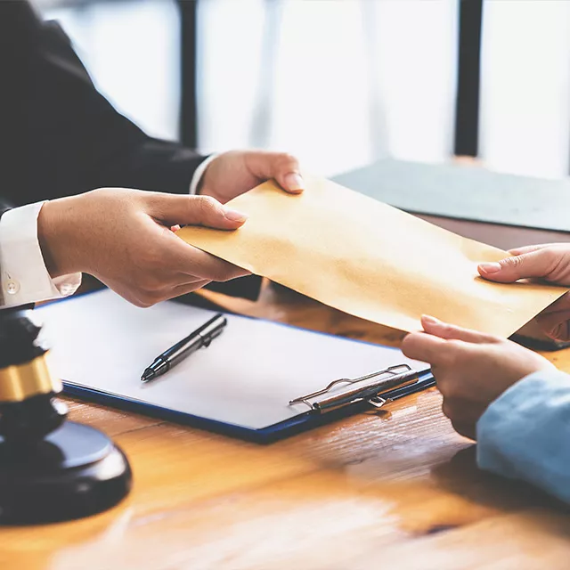 AdobeStock_470925329 Two business people sharing a document