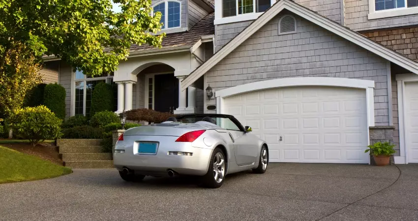 car in front of a closed garage door