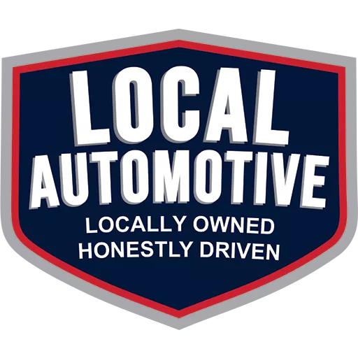 Logo design featuring the words "LOCAL AUTOMOTIVE" at the top in bold, white lettering, with the tagline "LOCALLY OWNED HONESTLY DRIVEN" below, all set against a dark blue shield shape with a red outline.