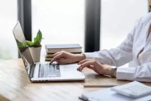 Person using a computer, representing cybersecurity and online data protection.