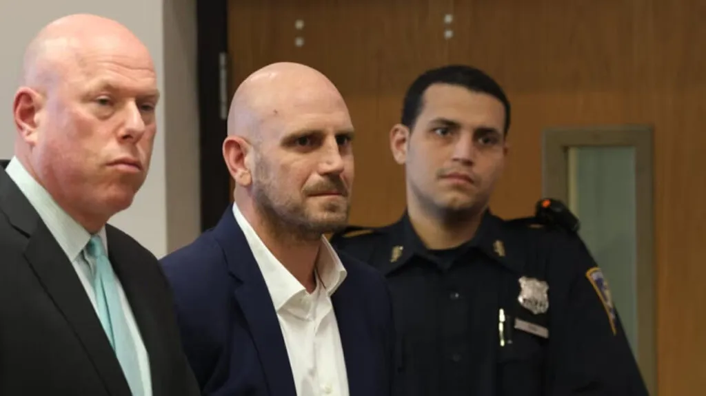 Daniel Tomasky appears with his attorney Michael J. Brown in Suffolk County Court in Riverhead Tuesday. Credit: Newsday/James Carbone