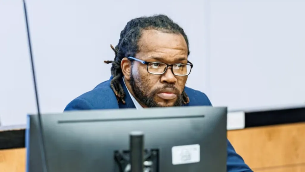 Mitchell Johnson listens to opening statements at his sex trafficking trial at the Cromarty Criminal Court in Riverhead on Thursday. Credit: Michael A. Rupolo Sr.