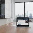 A modern office with a wooden desk shows an open laptop displaying โEmail Newsletter Content.โ On the left, digital charts highlight email marketing trends, while large windows reveal a cityscape.