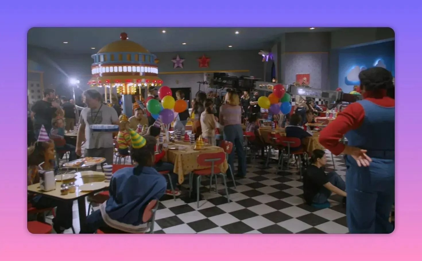inside Fazbear's pizzeria party floor with balloons, tables, children and a camera rig filming