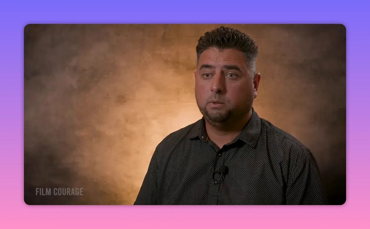 Sharp head-and-shoulders interview photo of the filmmaker against a warm textured backdrop, looking engaged and explaining permit logistics.
