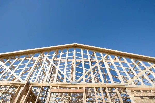 Wood frame of building revealing the architecture of the roof and gutters in San Marcos