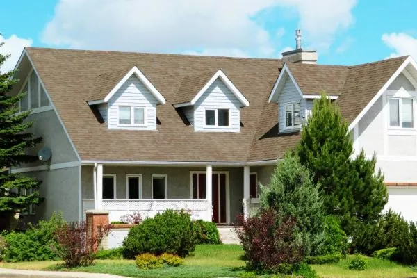 Exterior of two story home with shingle roof