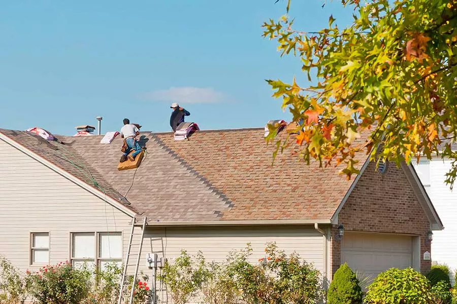 San Marcos TX roofing team performing roof maintenance in fall
