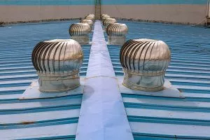 Turbine vents on a home's roofing, from the Kyle TX roof repair team at Divided Sky