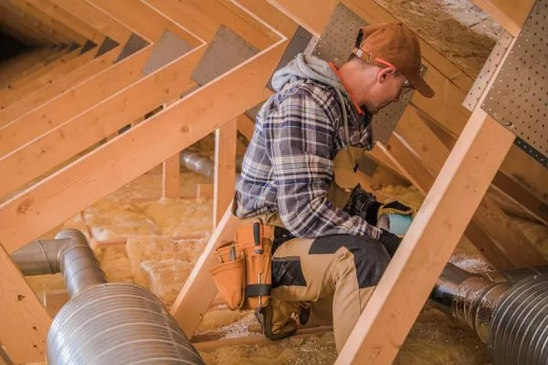 man working in an attic