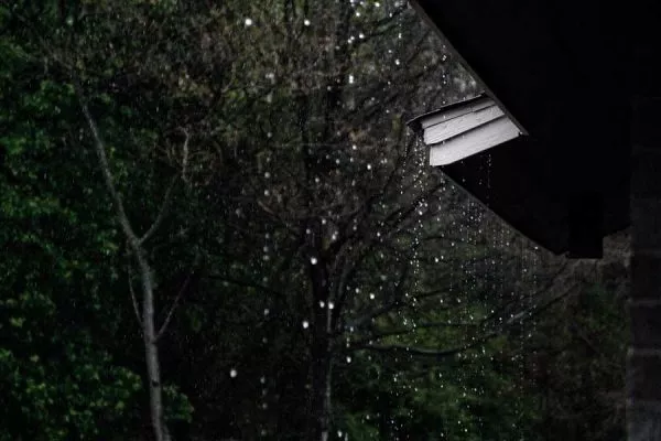 rain falling on a roof during a storm