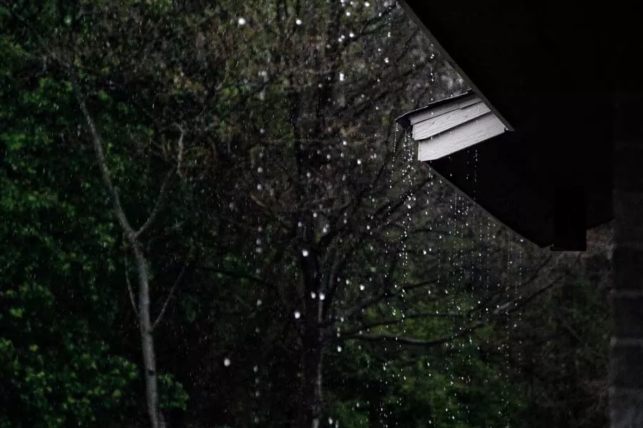 rain falling on a roof during a storm