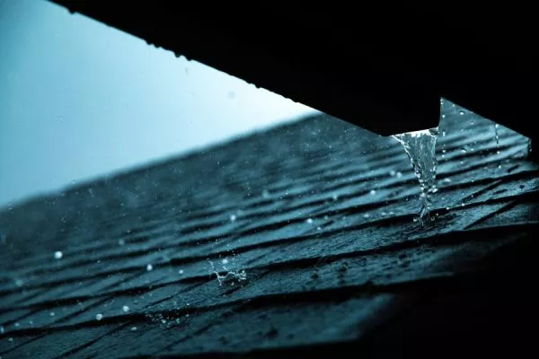 Troubling signs of water damage on a roof during heavy rainfall - Protect your home with a professional roof inspection from certified roofing experts in San Marcos TX!