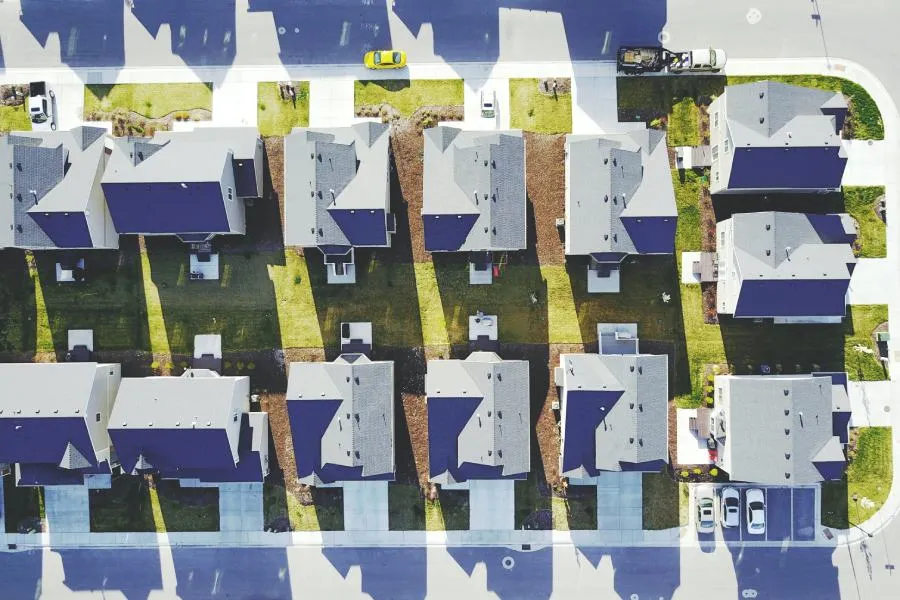 aerial view of suburban neighborhood in Seguin solar panels and high quality roofs