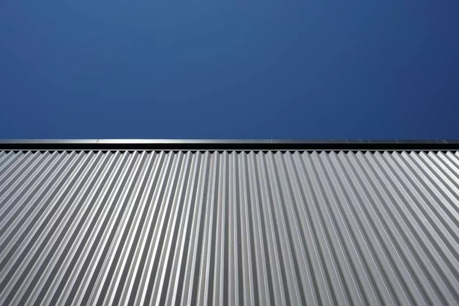 Metal roof on a commercial building installed by expert roofing contractors in New Braunfels TX