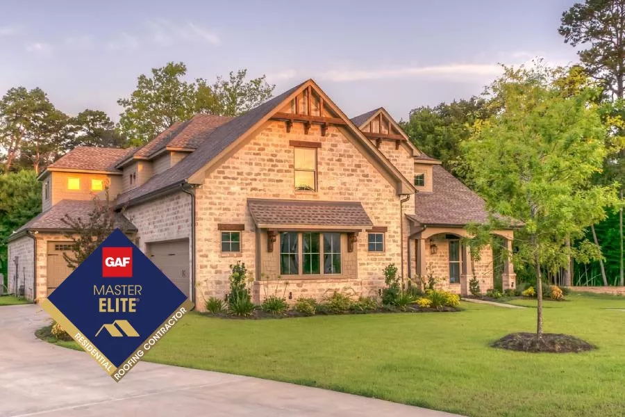 brick home with the GAF mater elite logo overlayed