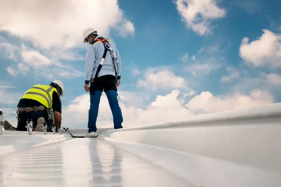 commercial roofing contractors working on a roof