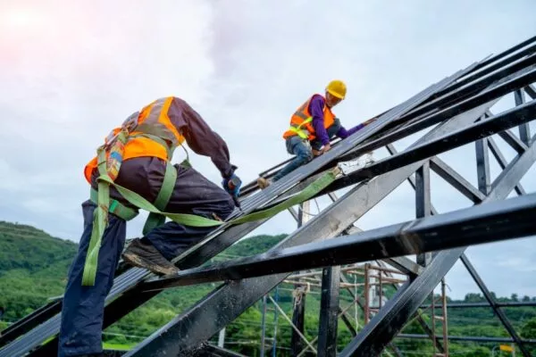 commercial roofing contractors working on a roofing frame