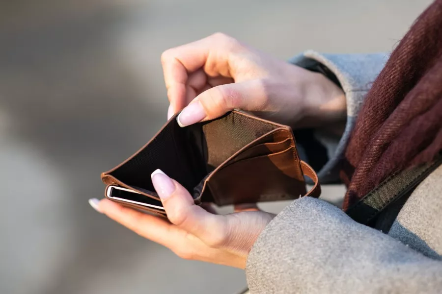 person opening an empty wallet
