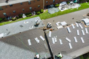 An aerial view of workers during a Buda roof replacement project.