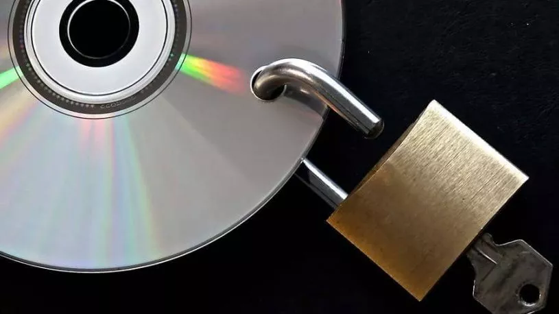 Locked disc being unlocked by a key