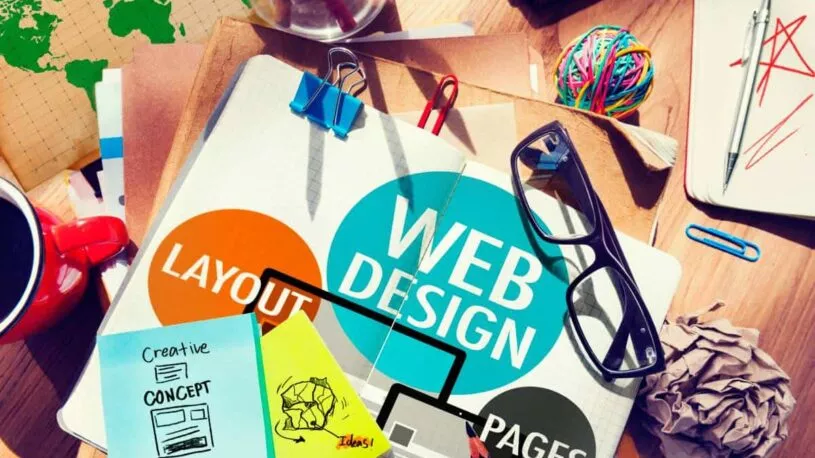 notebook with a Web Design message on the pages
