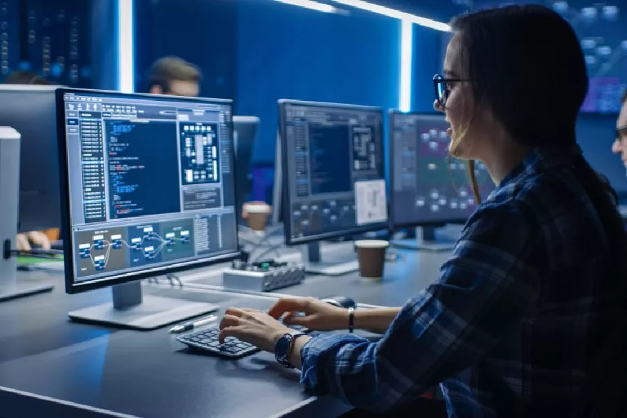 An Austin computer repair technician working in a modern tech lab.