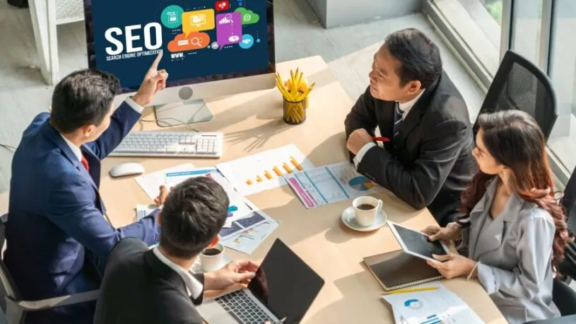 San Antonio SEO consultant presenting strategy to colleagues in office.